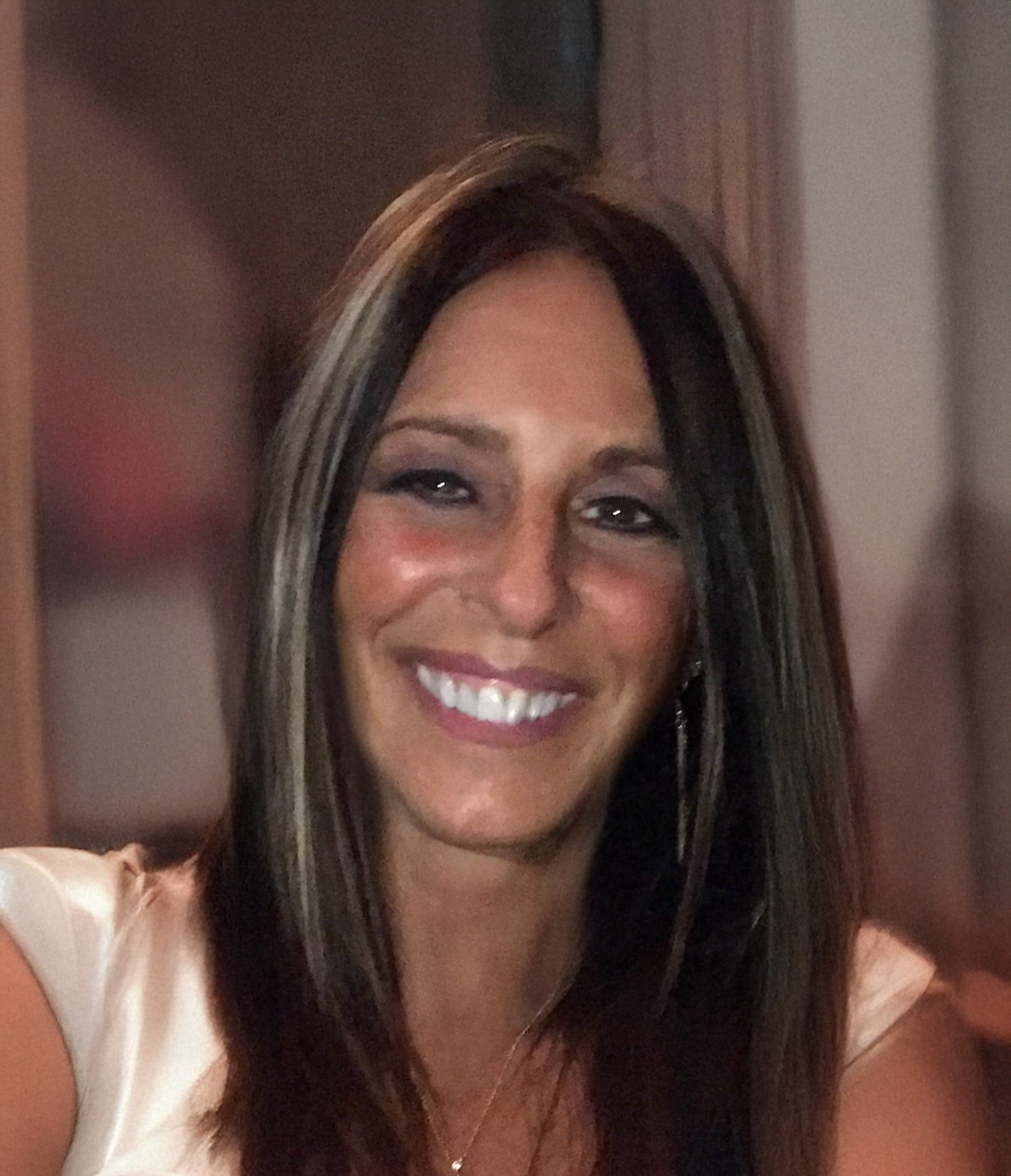 Diane Luksis, Partnership & Outreach Specialist at Atlanta Pack and Load, smiling in a casual setting, with a focus on customer-centric values and community engagement.